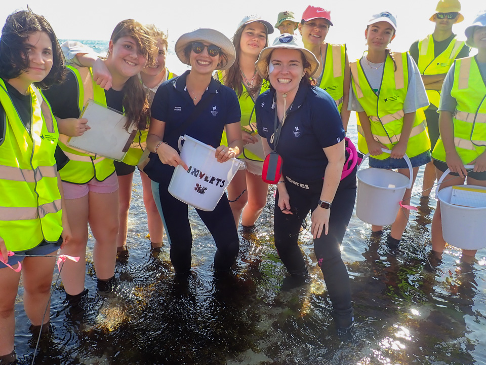 Kids with MSP scientists on the intertidal reef at Iluka Beach